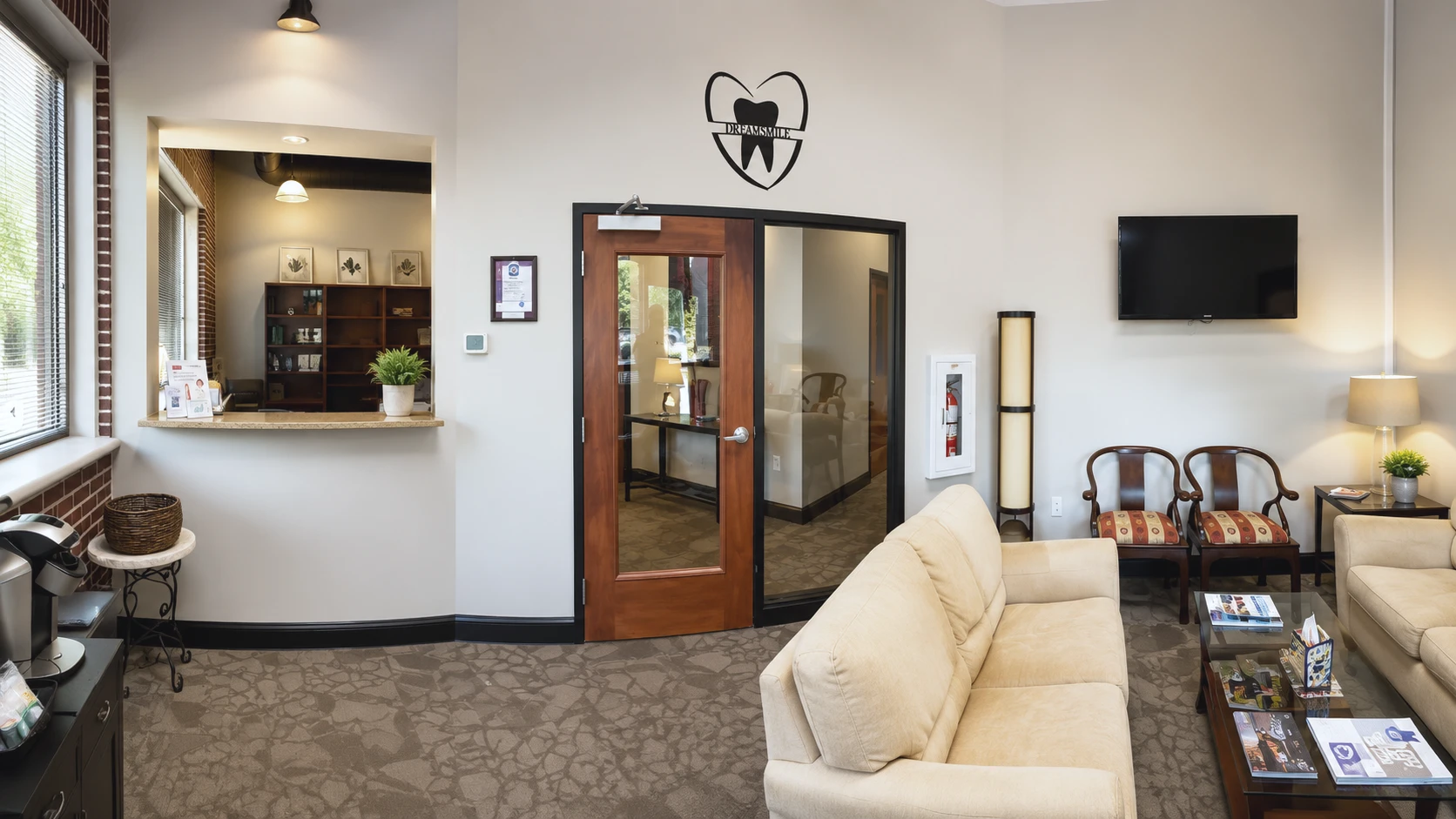 Reception and waiting area inside Premiere Dental Studio in Duluth, Georgia